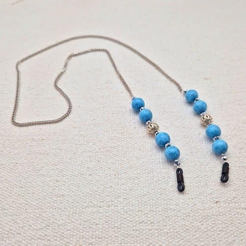 Chaine de lunettes femme maille fine palladium et perles turquoise et métal argenté ajouré, aux couleurs façon Reine des neiges