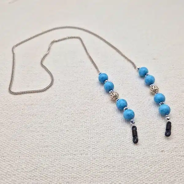 Chaine de lunettes femme maille fine palladium et perles turquoise et métal argenté ajouré, aux couleurs façon Reine des neiges
